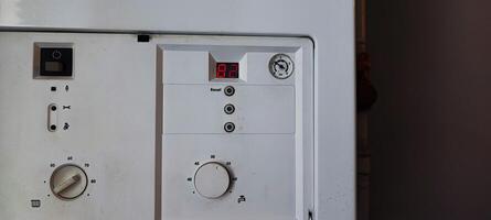 Gas Boiler Control Panel with a Error Code E1. Heating System Maintenance, Utility Technology, Home Appliance photo