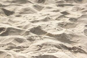 Sand is on the tropical beach in macro style. Sand is in Thailand. photo