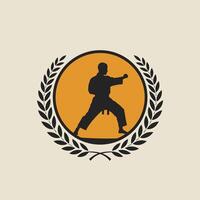 Karate Fighter encircled by a laurel wreath logo design vector