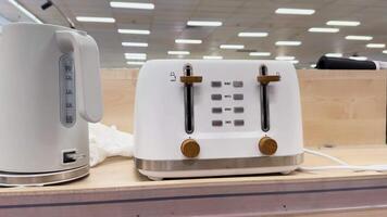 Toaster and kettle showcased on store counter video