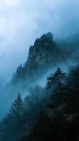 Heavy Fog Rolling Through A Mountain Pass photo