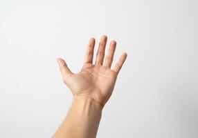 A hand reaching up to the sky photo