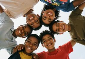 A group of young children standing in a circle photo