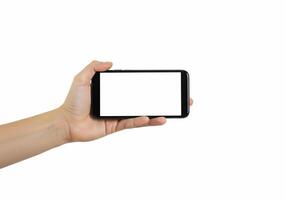 Hand holding a smart phone with blank screen photo