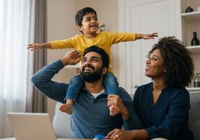 A family sitting on the couch with a laptop and a child photo