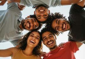 Group of friends smiling and looking up at camera photo