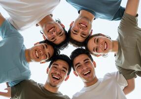 Five young men are smiling in a circle photo