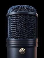A retro microphone on black background. photo