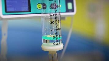 Saline solution dripping from IV in medical setting video