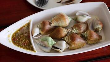 Boiled shells with spicy sauce in Krabi video
