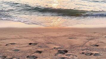 Serene sunset with waves and distant boat video