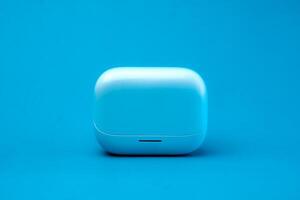 A modern wireless earbuds charging case in a sleek blue design, isolated on a vibrant blue background. Compact, lightweight, and stylish, perfect for travel and daily use. photo