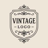 Elegant Vintage Logo Design with Ornate Flourishes and Classic Shield Shape vector