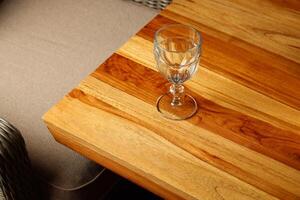 An Elegant Glass Set Beautifully Placed on a Wooden Table Creates a Stunning Display photo
