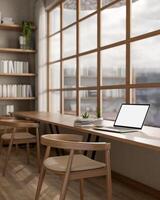 White screen laptop on long table under a glass wall next to large bookshelf. library or study room photo