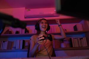 Gaming Enthusiast Celebrating Victory in a Colorful Setup photo