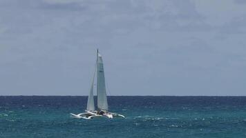 Sailboat navigating calm ocean waters video