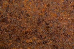 Close-up of Rusty Metal Surface with Textured Details and Corrosion photo