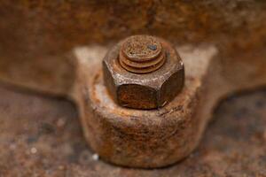 Rusty bolt and nut close-up. Shallow depth of field. photo