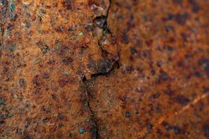 Close-up of rusted metal surface showing intricate corrosion patterns. photo