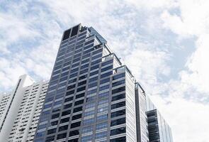 Bangkok Thailand 1 July 2025 Bottom up view tower building with blue sky background photo