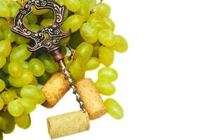 Corkscrew,wine stopper. Good old brandy, cognac, ripe grapes photo