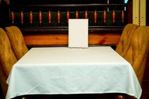 A table in a cafe, ready to receive guests, visitors photo