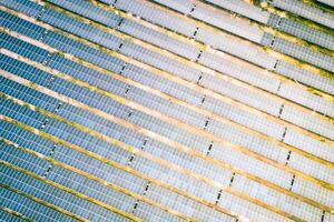 Solar energy farm.High angle, elevated view of large wide solar panels on an energy farm in rural England, full frame background texture photo
