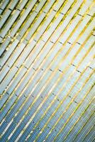 Solar energy farm. High angle, elevated view of large wide solar panels on an energy farm in rural England- full frame background texture photo