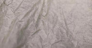 crumpled paper for packaging , a sheet of paper crumpled after use photo