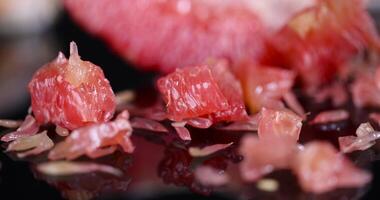 peeled citrus grapefruit with bright red and juicy flesh photo