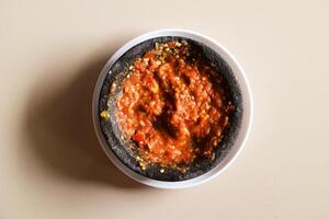 Top view of Indonesian chili tomato sambal with shrimp paste photo