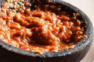 Indonesian sambal with chili tomato and shrimp paste close up photo