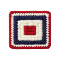Square, handwoven patch features concentric layers of red, white, and blue yarn, creating bold geometric pattern. texture is rich and tactile, showcasing intricate craftsmanship png