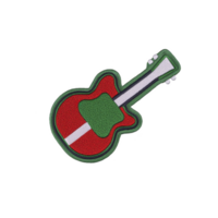 Colorful embroidered patch in shape of guitar, featuring vibrant red and green colors with white stripe, set against transparency background png