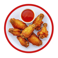 Crispy fried chicken wings served on white plate with red rim, accompanied by small bowl of spicy red dipping sauce png