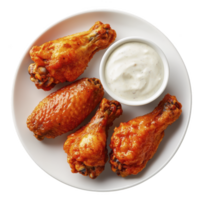 Crispy buffalo chicken wings served with creamy ranch dressing on white plate, perfect for savory snack or appetizer png