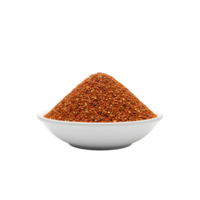 A white bowl filled with a generous pile of coarse ground red spice blend isolated on transparent background png