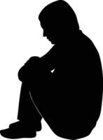 Silhouette of a Person Sitting with Knees to Chest in a Depressed State vector