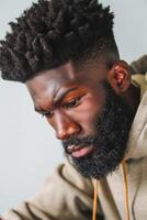 Man with a beard and dreadlocks is wearing photo