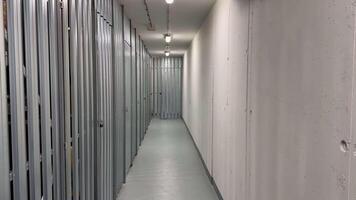 A hallway in a modern storage facility with secure, accessible units for safety and organization photo
