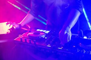 Dj mixing music at a party photo
