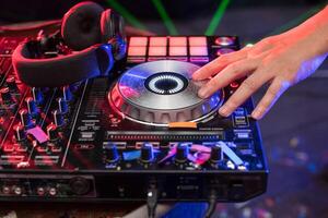 A person is playing a dj at a party photo