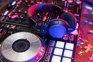Dj equipment and headphones on a table photo