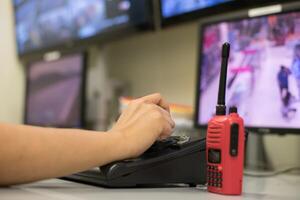 A person is using a radio to talk to someone photo