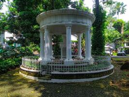 Classical Garden Pavilion Serene White Structure in Lush Greenery photo