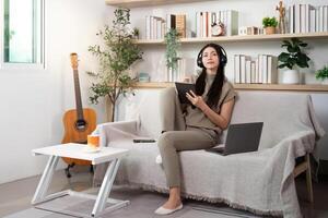 Woman using a tablet at home photo