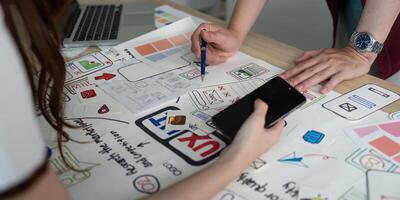 Hands-on UX and UI design collaboration with sketches. photo