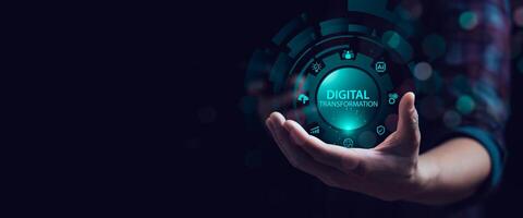 Hand holding glowing digital transformation icon with futuristic technology interface, AI chip, cloud computing, analytics and automation concept for innovation, smart business and digital strategy photo