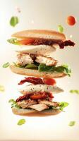 A stacked sandwich with layers of chicken, lettuce, tomato, and sun-dried tomatoes. Ingredients are floating around, creating a dynamic food scene. photo